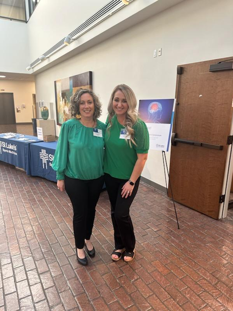 St. Luke's staff with concussion information display.