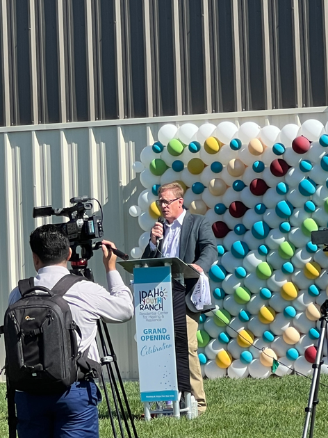  Man speaks from podium