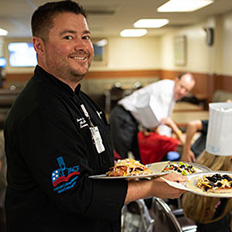  St. Luke's staff serving food.