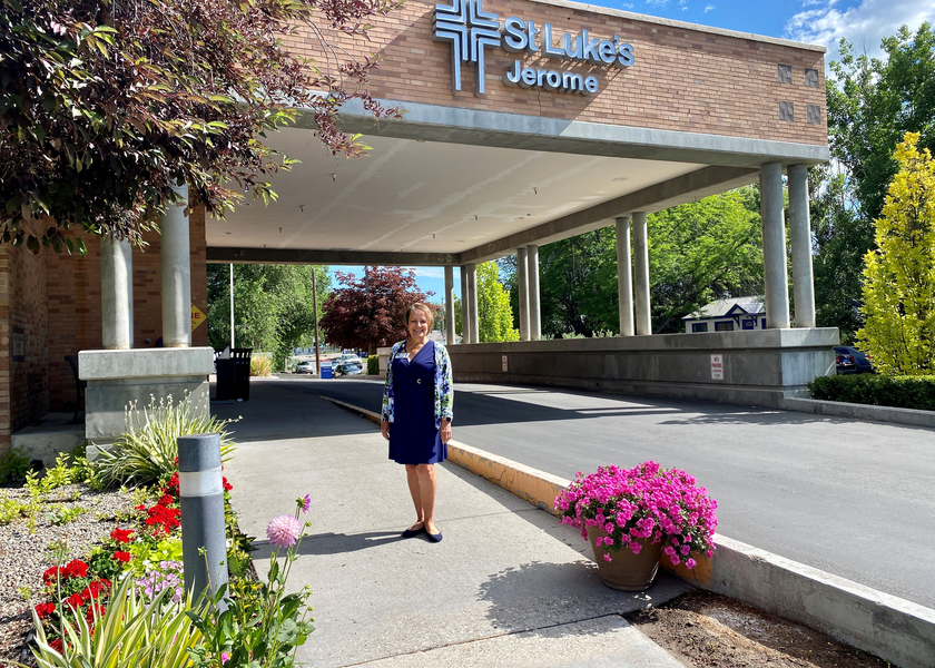 Smiling woman in front of hospital bay