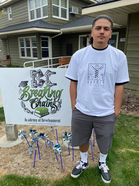  Young man in front of house