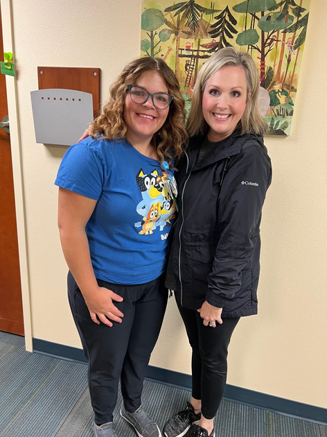  Two women smile at camera
