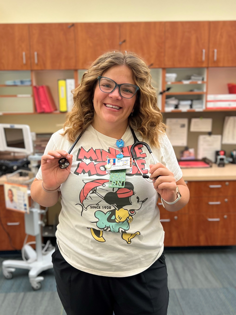  Woman smiles broadly at camera