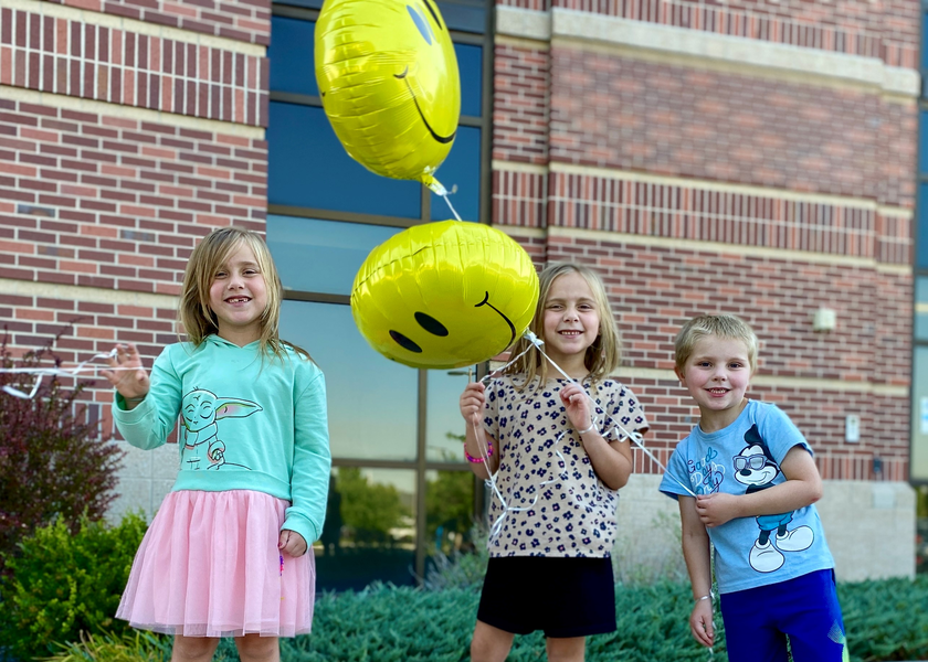  Kids with balloons outside of the St. Luke's Magic Valley Medical Center