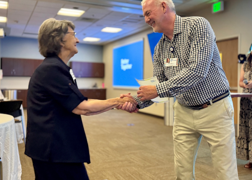 Two people shaking hands. 