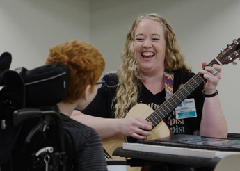 Kathrine Lee with a patient during music therapy.