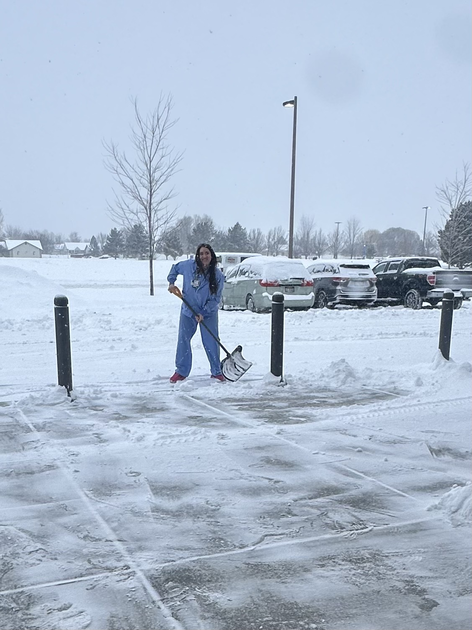  Assistant nurse manager, Dani Nunnally, helps shovel snow.