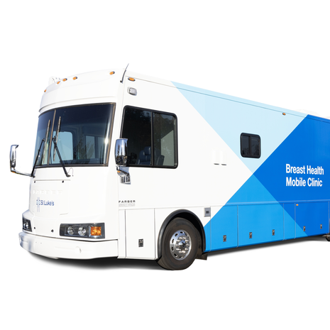 blue and white bus with “breast health mobile clinic”