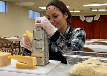 Woman shredding cheese