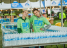 Two volunteers at the water station at FitOne Finish Festival