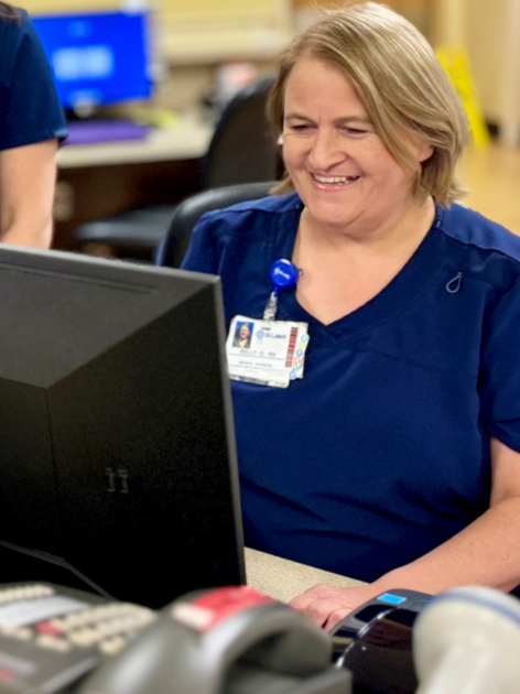  Kelly Osborne works on her computer.