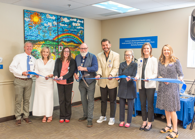 Group of St. Luke’s health professionals gathered together to cut the opening ribbon. 