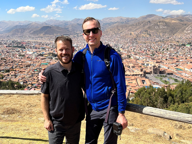 Doctor's standing together at outlook over Cusco, Peru.