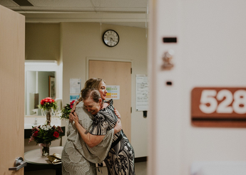 Mother and daughter hugging during wedding event at St. Luke's Meridian.