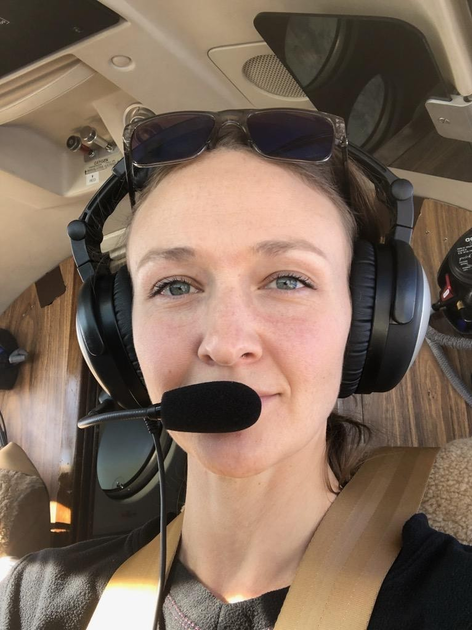  Woman wearing pilot headset
