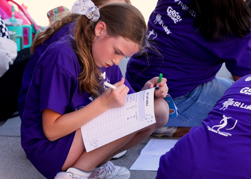 Girl filling out a form.