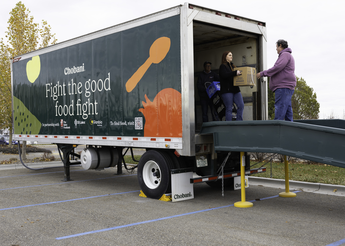 Chobani refrigerated truck being unloaded by St. Luke's Community Health and Engagement team members.