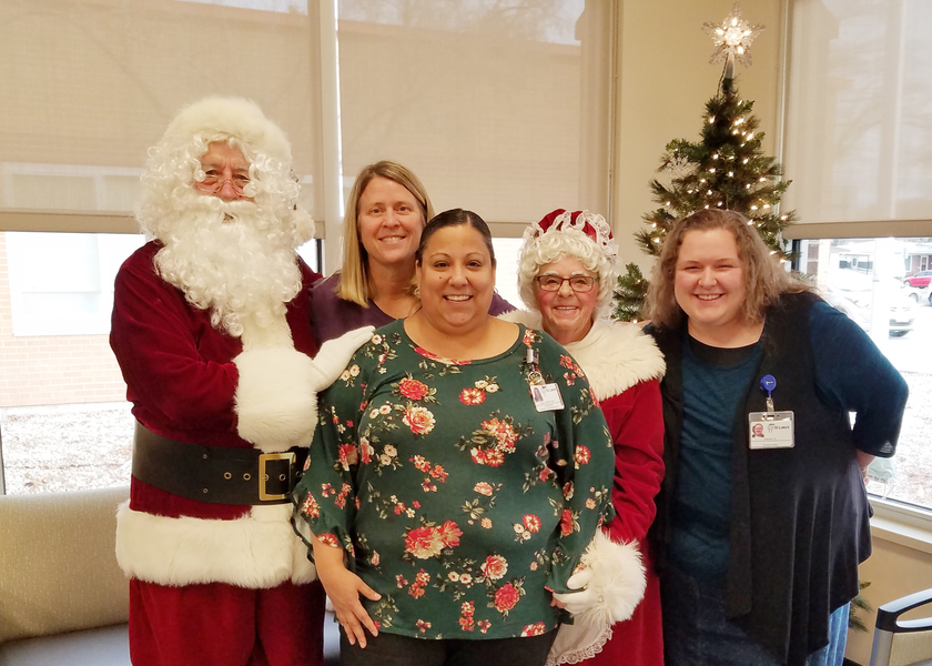 Bob and Sandy Sonnentag pose with St. Luke's Elmore employees.