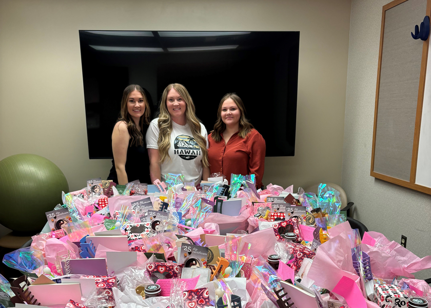 Alyssa Higbee poses with the donated gift bags