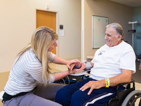 Therapist works with recovering stroke patient