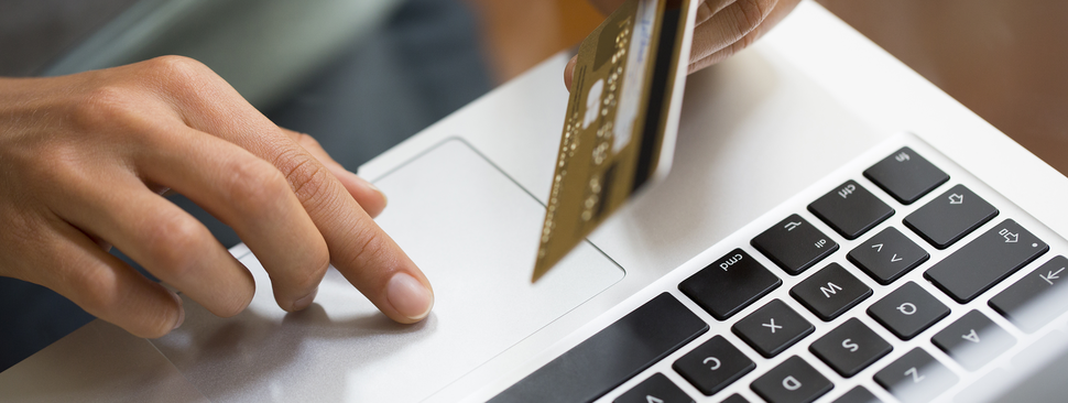 Man pays bill with credit card.