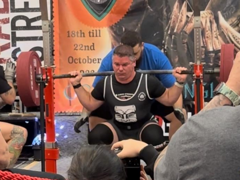 Tony lifting weights.