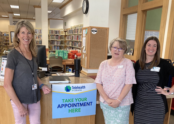 St. Luke's Wood River senior outreach coordinator Erin Buell, reference librarian Laura Primrose and St. Luke's telehealth director Abby Losinski at the opening of the pod at the Hailey Library.