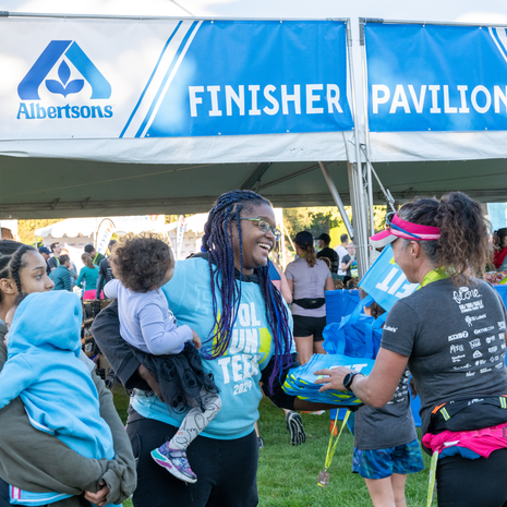 Family heading into the Albertson’s Finisher Pavilion