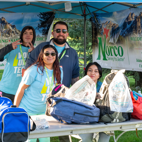 Volunteers with checked gear by Norco van