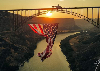 Air St. Luke's helicopter and American flag in front of the Perrine Bridge near Twin Falls Idaho.
