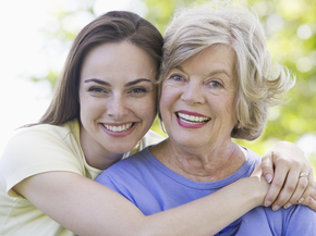 Mother with her adult daughter smiling