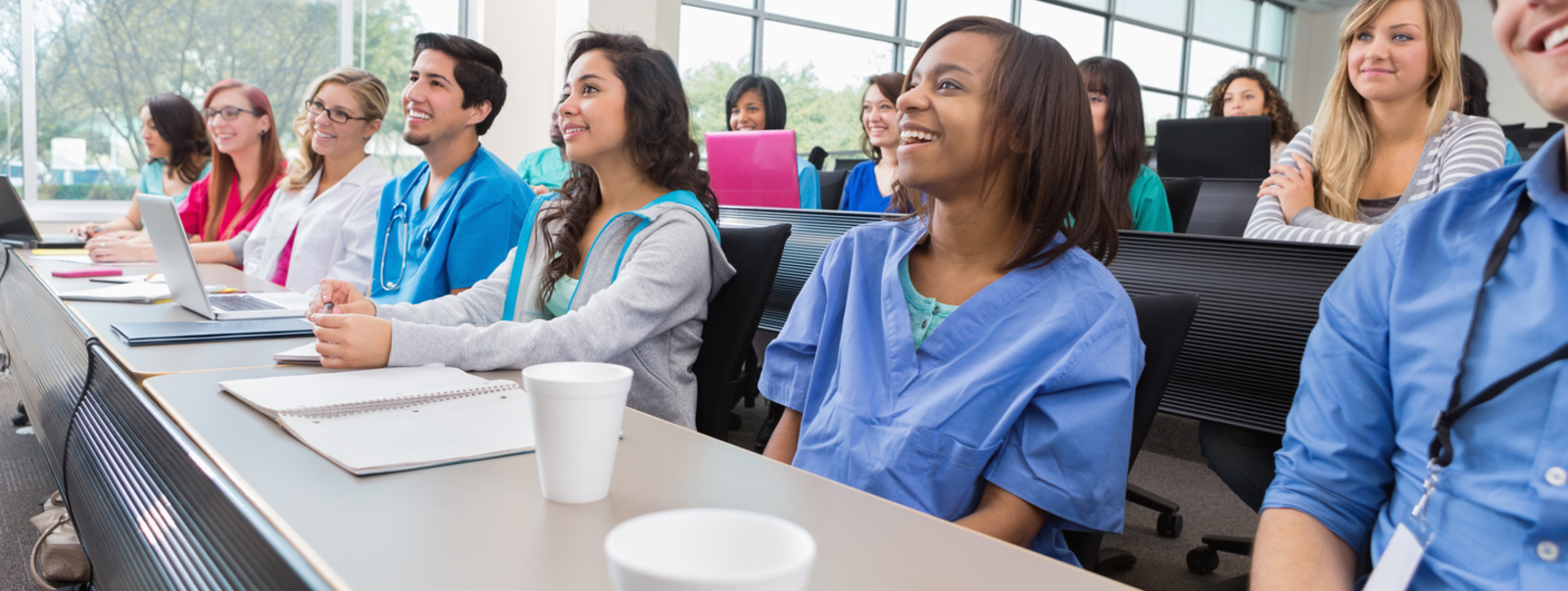 Conference attendees listen to speaker.