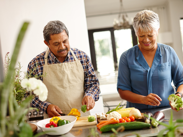 Couple preparing vegetables