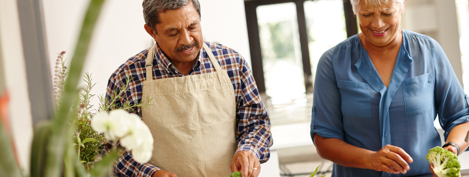 Couple preparing vegetables