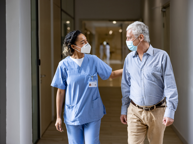 Nurse and patient walking together
