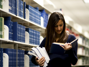 Woman doing research in a library 