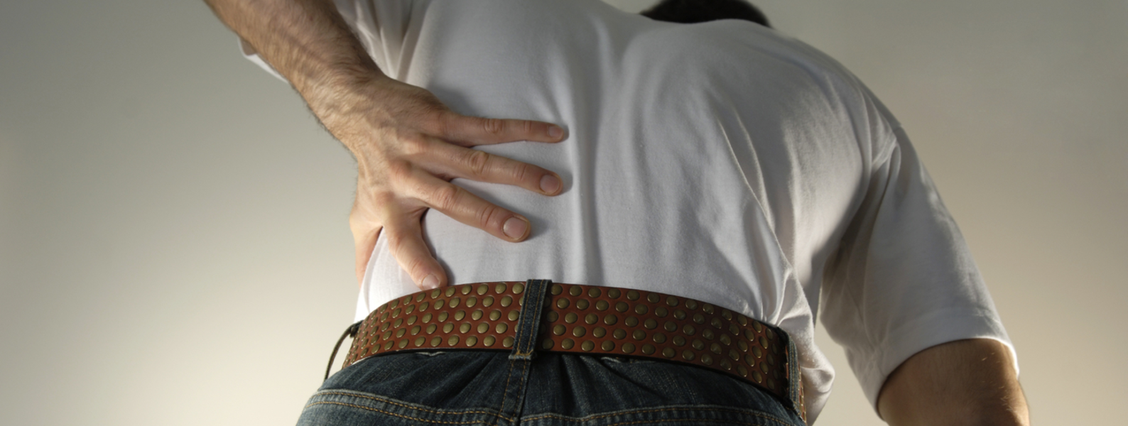 A man holding his back
