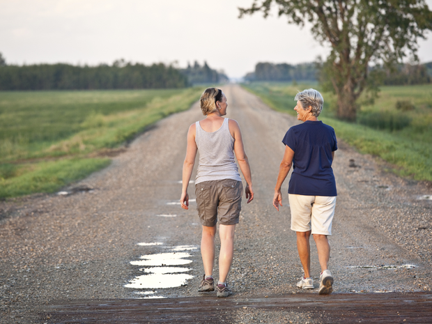 Two women walking down a street.