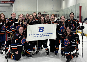 Boise State women's club hockey team gather on the ice. 