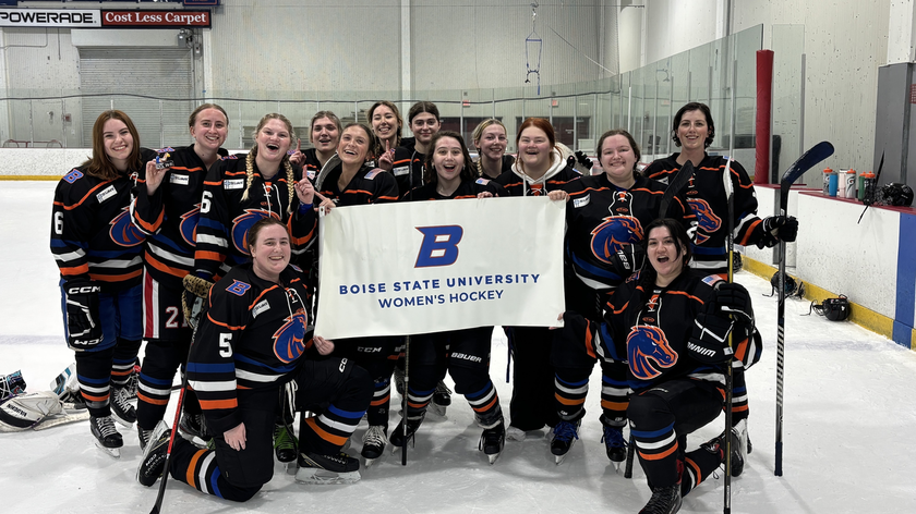 Boise State women's club hockey team gather on the ice. 