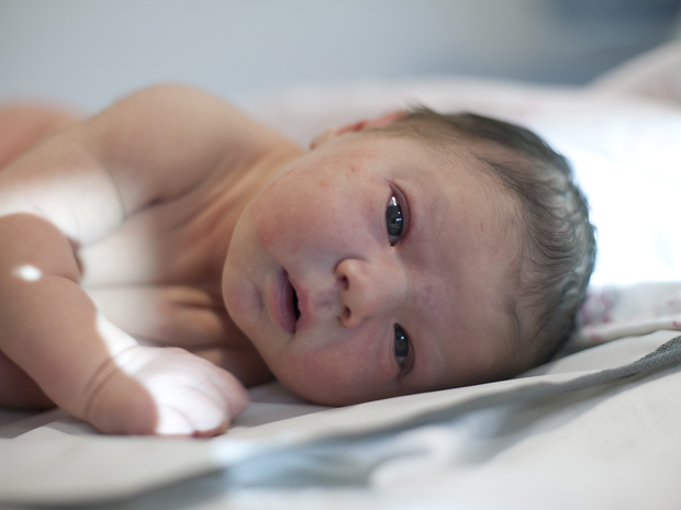 Baby lying on its side