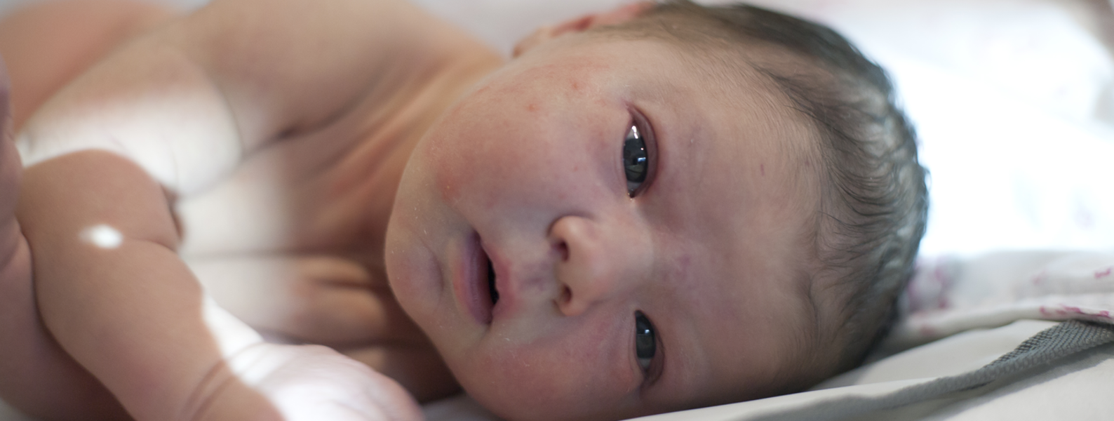 Baby lying on its side