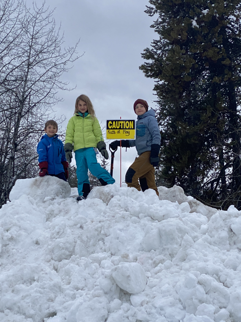  Children standing next to sign