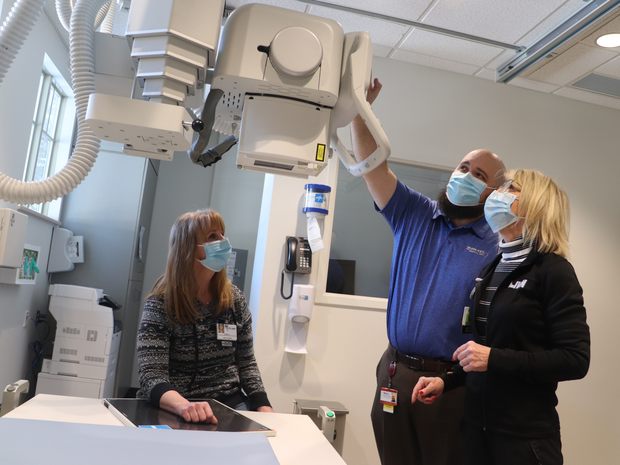 Staff Members with a new piece of imaging equipment.