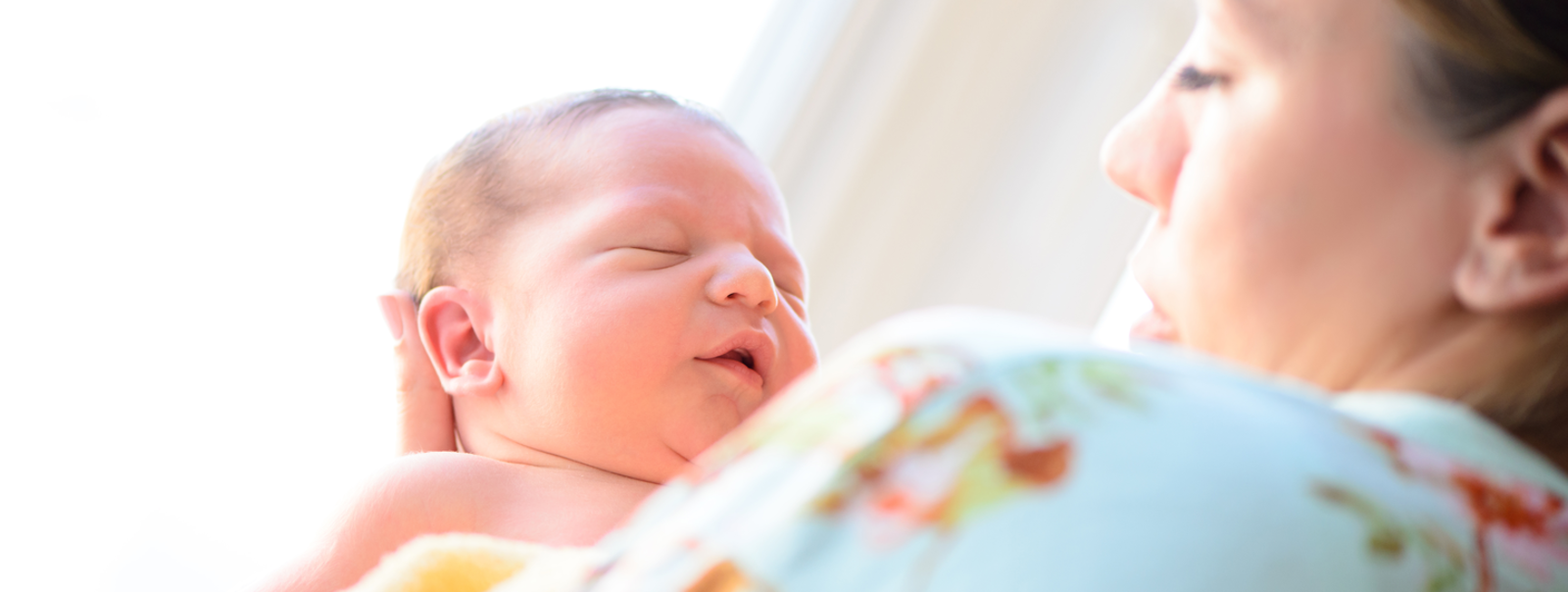 Mother holding her newborn.