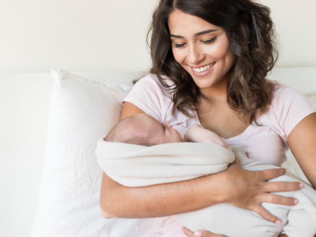 Mother holding her infant.