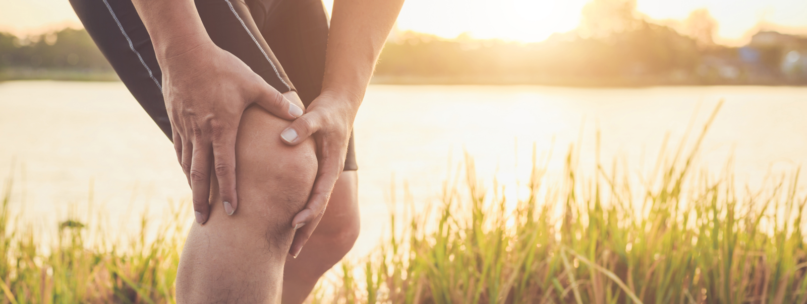 Runner holding a sore knee