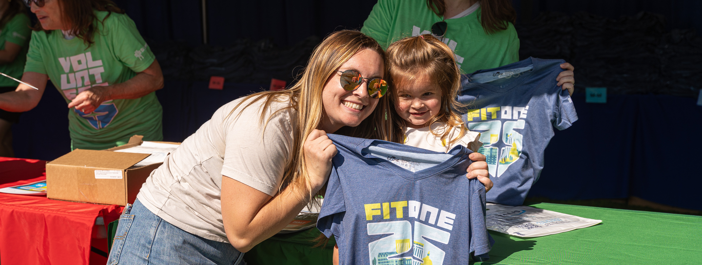 Mother and daughter at FitOne packet pickup event