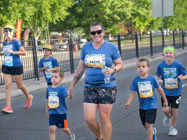 Moms running the FitOne 5K with young children
