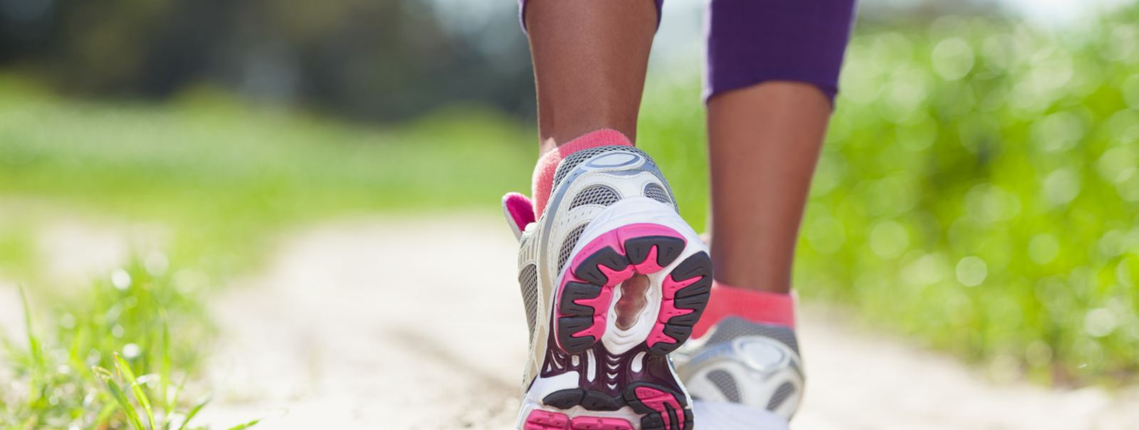 Woman walking a trail.
